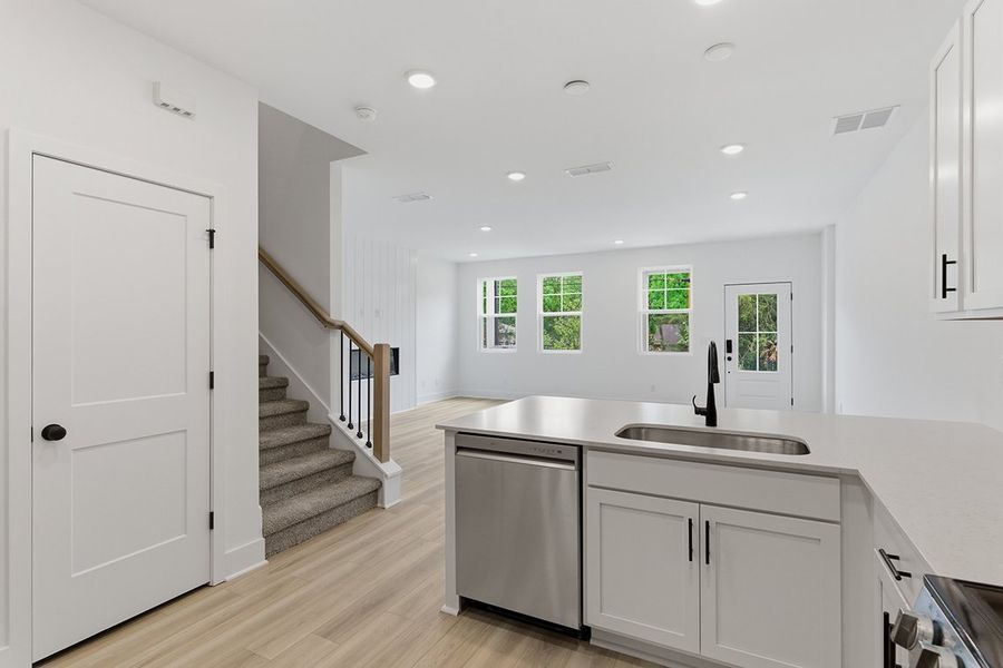 A kitchen with white cabinets. A kitchen with white cabinets.
