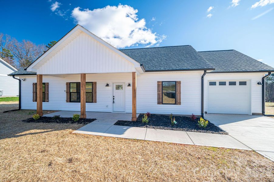 Front exterior of a new home in , Hickory, NC, highlighting curb appeal (Image 17).