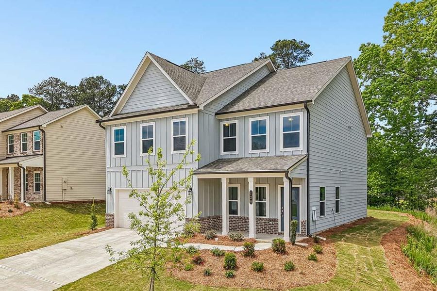 Front exterior of a new home in The Estates at Casteel, Bethlehem, GA, highlighting curb appeal (Image 19). Front exterior of a new home in The Estates at Casteel, Bethlehem, GA, highlighting curb appeal (Image 19).