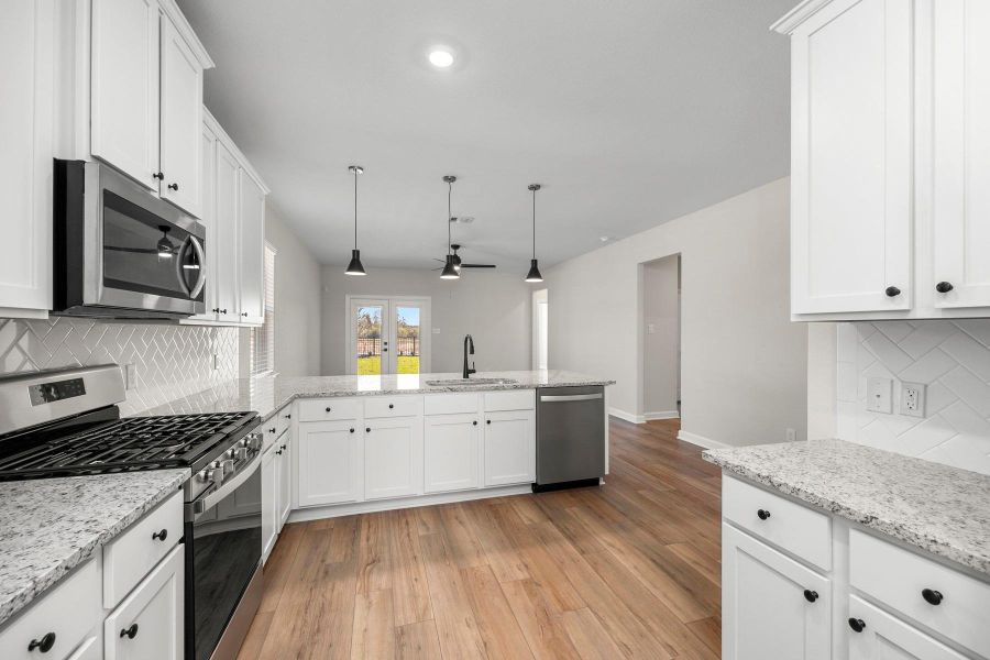 Furnished interior view inside a new home in Sunterra, Katy (Image 3).