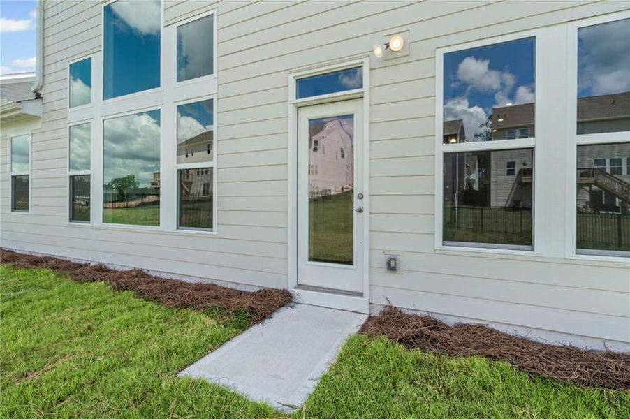 Front exterior of a new home in Twin Lakes, Hoschton, GA, highlighting curb appeal (Image 28).
