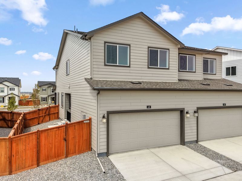 Front exterior of a new home in Sky Ranch, Watkins, CO, highlighting curb appeal (Image 24).