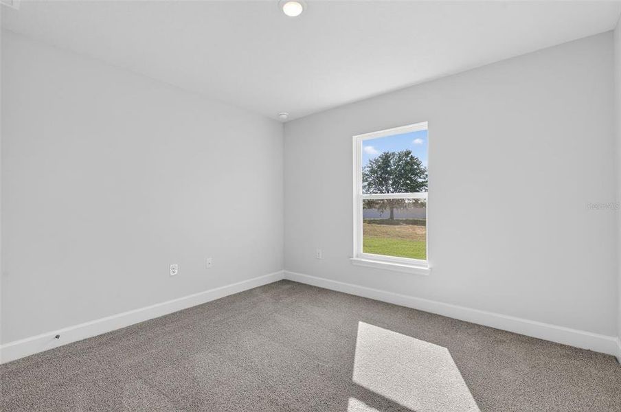 Spacious, unfurnished interior of a new home in Hill Country Estates, Dade City (Image 49).