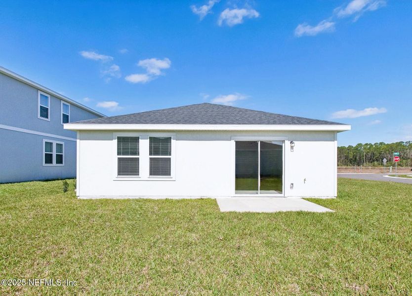Exterior details and patio area of a home in Flagler Village - Classic Series, Palm Coast (Image 21).