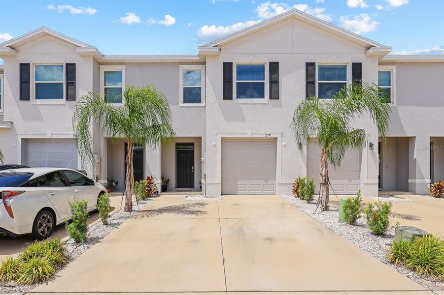Front exterior of a new home in , Apollo Beach, FL, highlighting curb appeal (Image 1).
