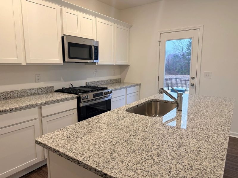 Kitchen - Chic white finishes and smooth surfaces shine. Kitchen - Chic white finishes and smooth surfaces shine.