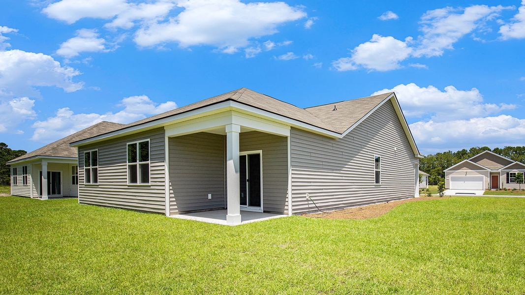Front exterior of a new home in Harper Meadows, Loris, SC, highlighting curb appeal (Image 2).