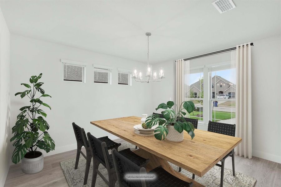 Dining room with wood table, black chairs, chandelier, and large window with natural light