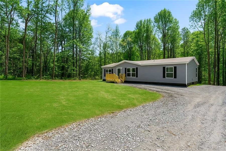 Exterior details and patio area of a home in , Ellijay (Image 24).