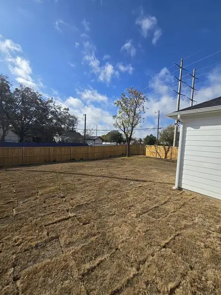 View of fenced backyard