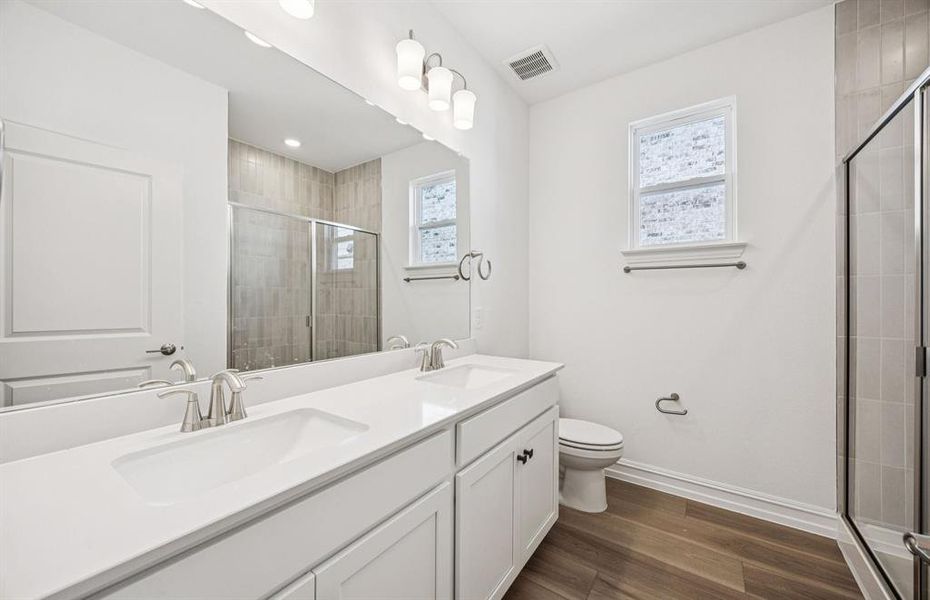 Secondary bathroom with double sinks Secondary bathroom with double sinks