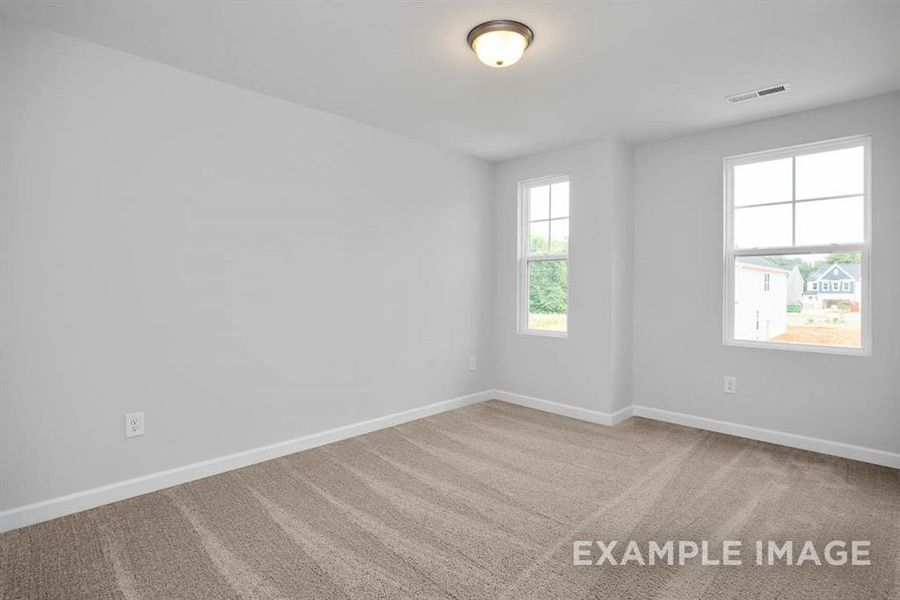 View of carpeted spare room