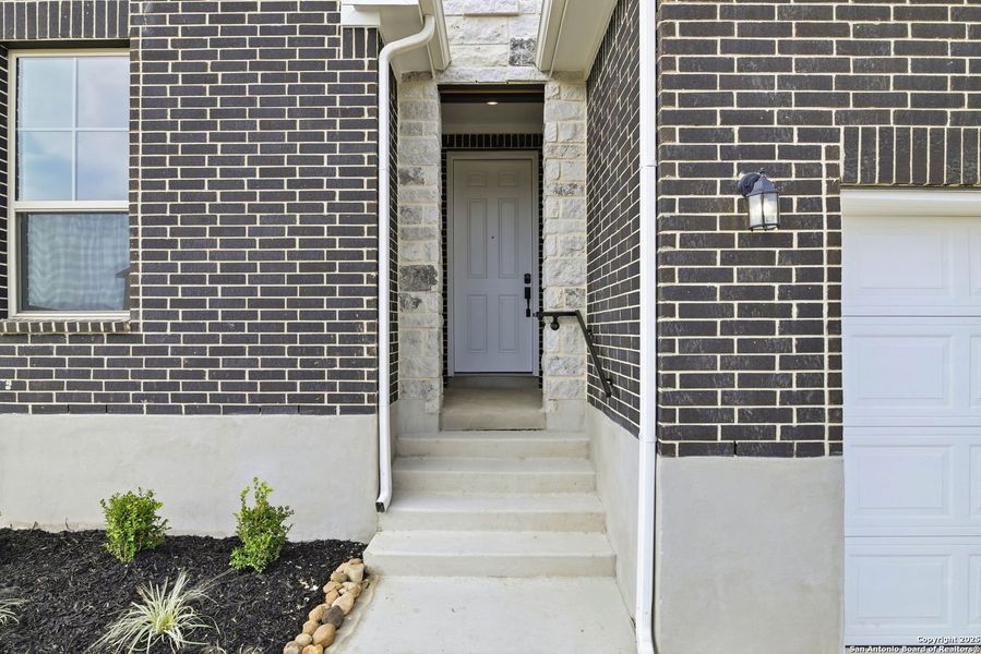 Exterior details and patio area of a home in Vista Ridge, Live Oak (Image 4).