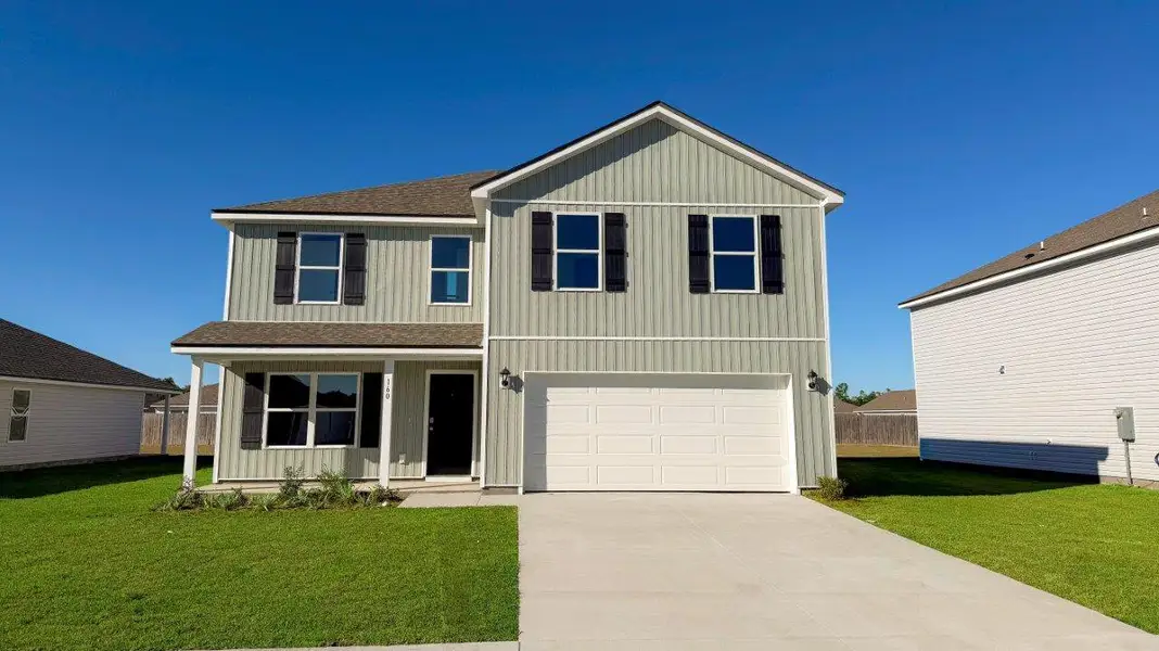 Front exterior of a new home in Wesley Park, Crawfordville, FL, highlighting curb appeal (Image 1).