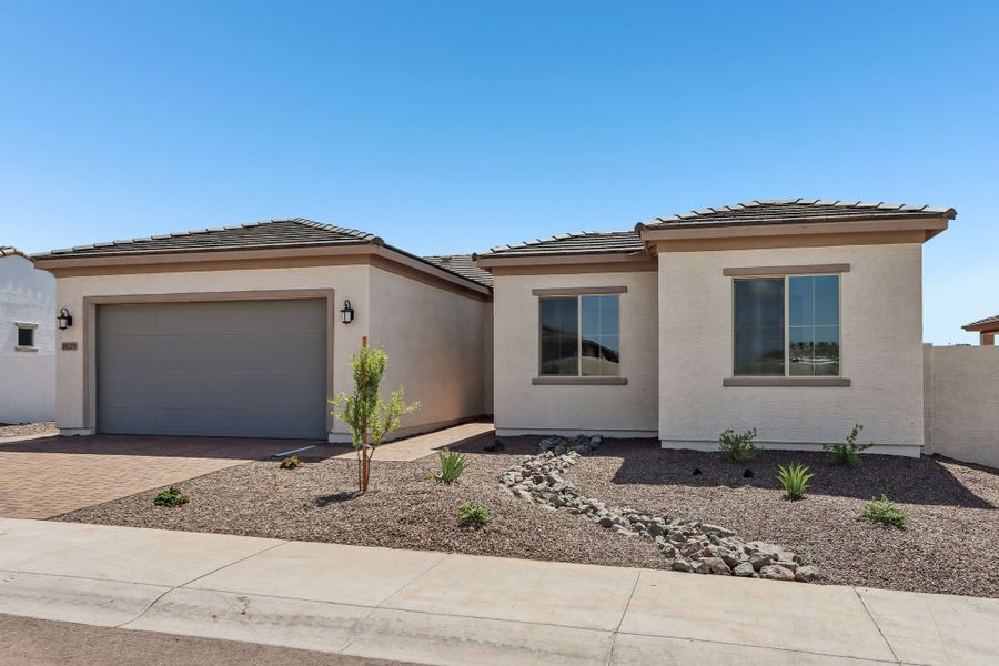 Front exterior of a new home in Estrella, Goodyear, AZ, highlighting curb appeal (Image 21).