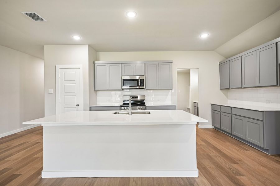 Kitchen in the Harrison home plan by Trophy Signature Homes