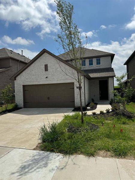 View of front of property featuring a garage