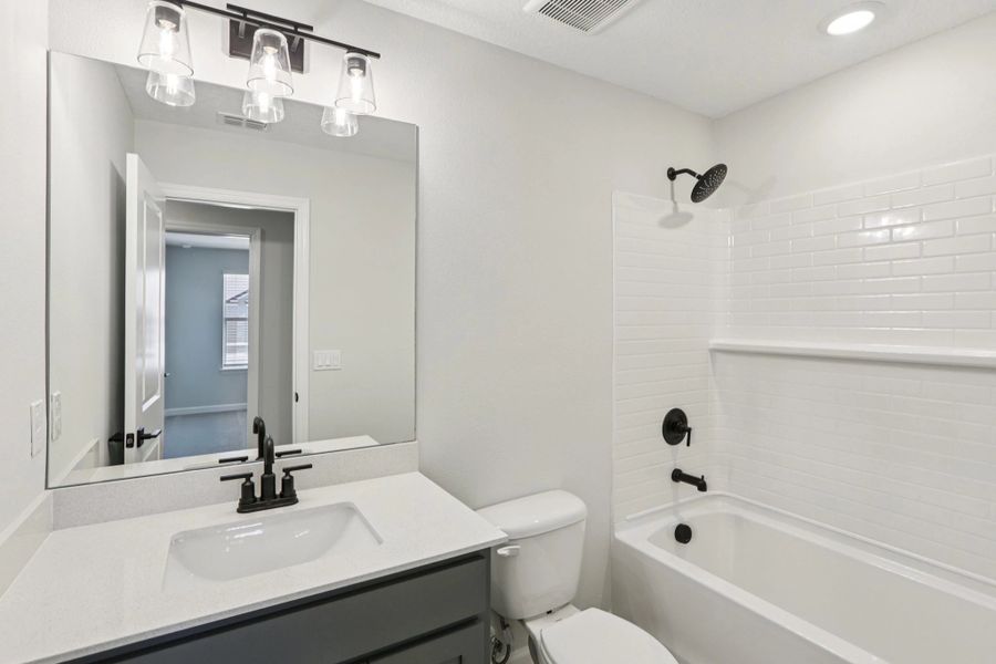 Bathroom 2 located near bedroom 2 and 3 featuring aspects of AW Collection® - Representative images and renderings are for illustrative purposes
