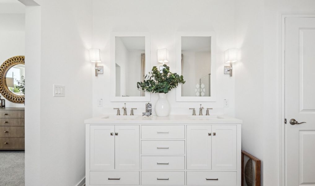 Primary bath features freestanding vanity with dual sinks Primary bath features freestanding vanity with dual sinks
