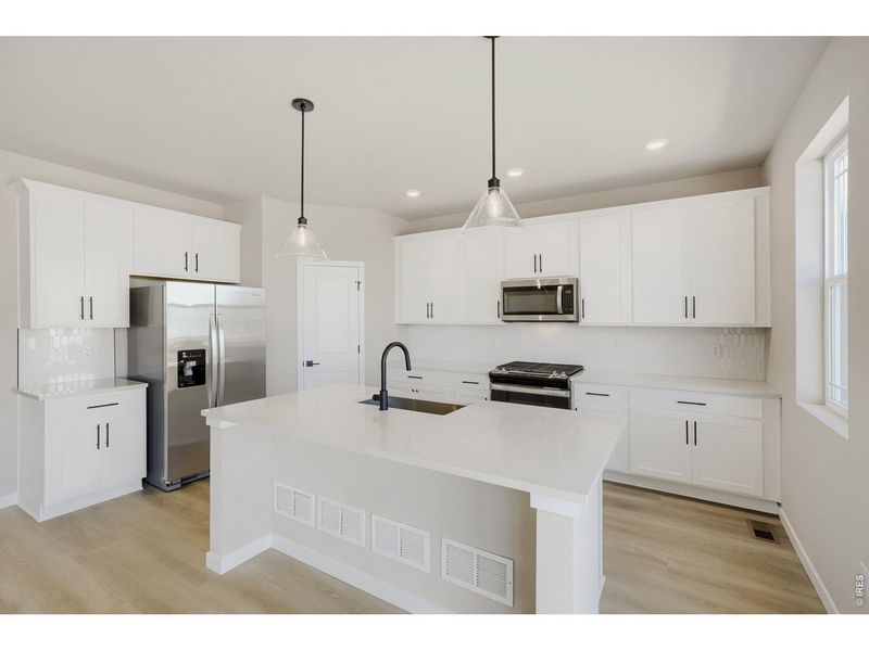 Furnished interior view inside a new home in Farmstead, Berthoud (Image 6).