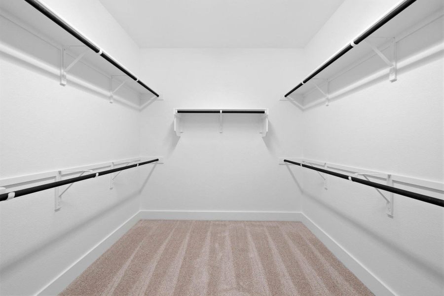 Walk-in closet in Primary Bedroom Walk-in closet in Primary Bedroom