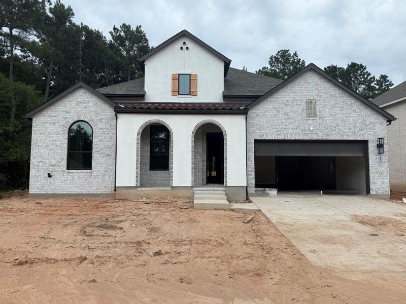 Front exterior of a new home in COLTON: 60ft. lots, Magnolia, TX, highlighting curb appeal (Image 1). Front exterior of a new home in COLTON: 60ft. lots, Magnolia, TX, highlighting curb appeal (Image 1).