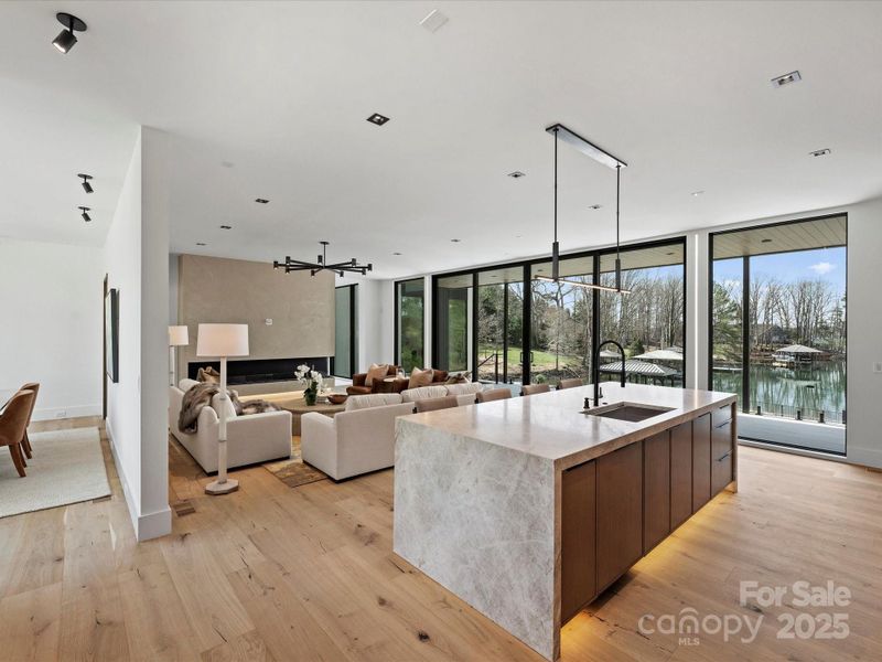 Floor to ceiling windows illuminate the kitchen with natural light