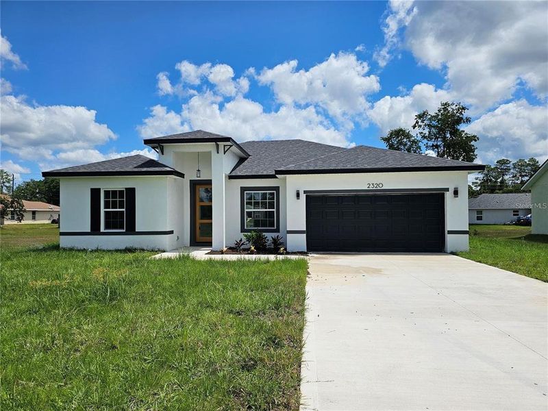 Front exterior of a new home in , Ocala, FL, highlighting curb appeal (Image 1). Front exterior of a new home in , Ocala, FL, highlighting curb appeal (Image 1).