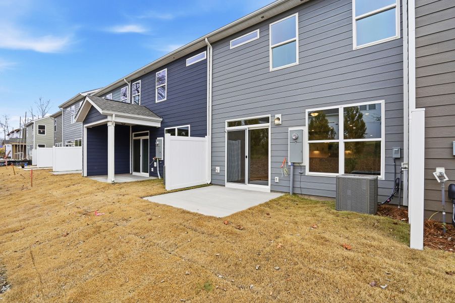 Exterior details and patio area of a home in Harrisburg Village Townhomes, Harrisburg (Image 28).
