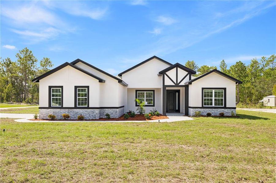 Front exterior of a new home in , Dunnellon, FL, highlighting curb appeal (Image 1). Front exterior of a new home in , Dunnellon, FL, highlighting curb appeal (Image 1).