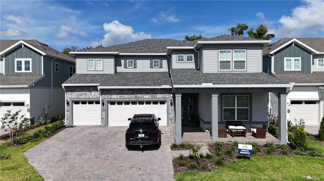 Front exterior of a new home in , Winter Garden, FL, highlighting curb appeal (Image 2). Front exterior of a new home in , Winter Garden, FL, highlighting curb appeal (Image 2).