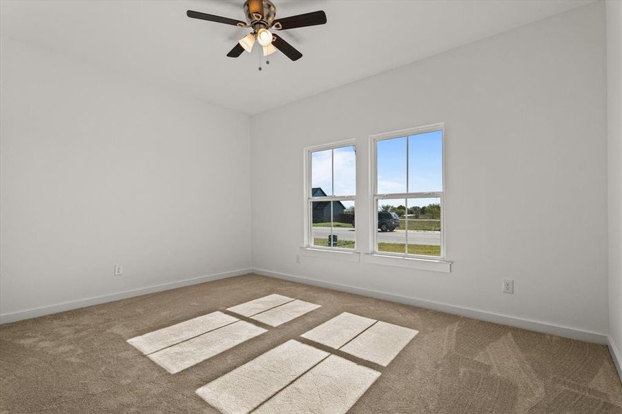 Bedroom with carpet flooring and ceiling fan