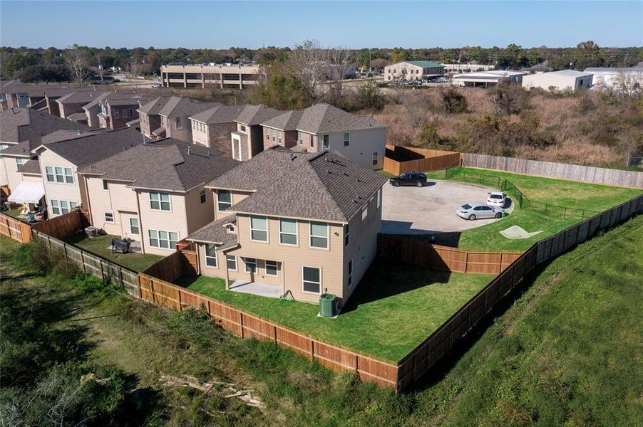 Covered back porch and large fenced-in back and side yard.