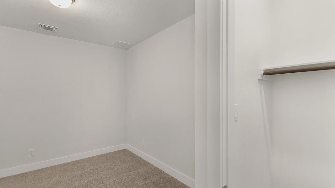 Representative unfurnished interior of a home built from the Brenner by Chesmar Homes in Newhaven, Manor (Image 33).