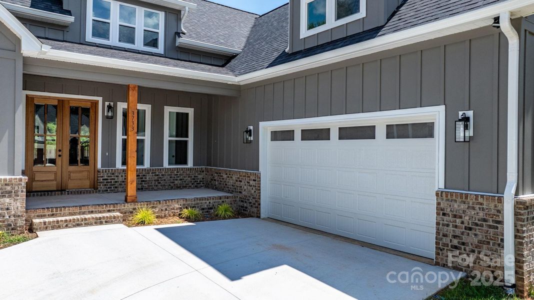 Front exterior of a new home in , Hickory, NC, highlighting curb appeal (Image 28).