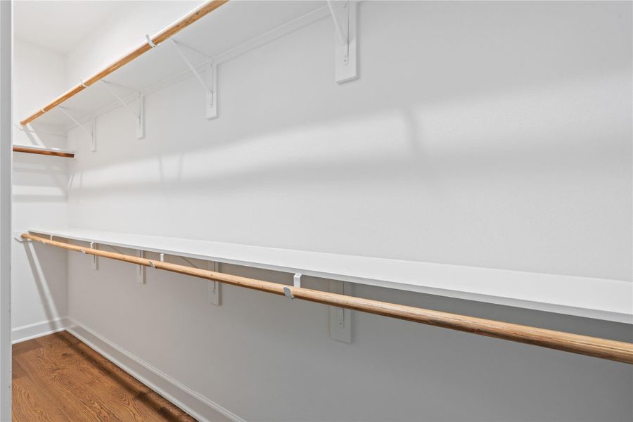 The secondary closet provides extra hanging space, giving the suite a more functional, everyday flow.