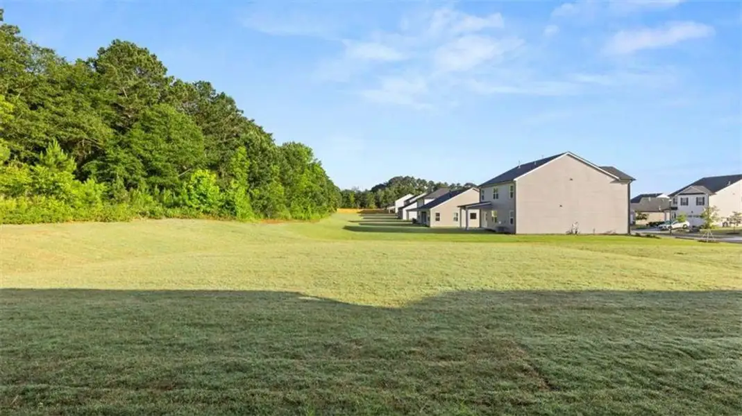 Exterior details and patio area of a home in Preserve at Dove Creek, Statham (Image 4).