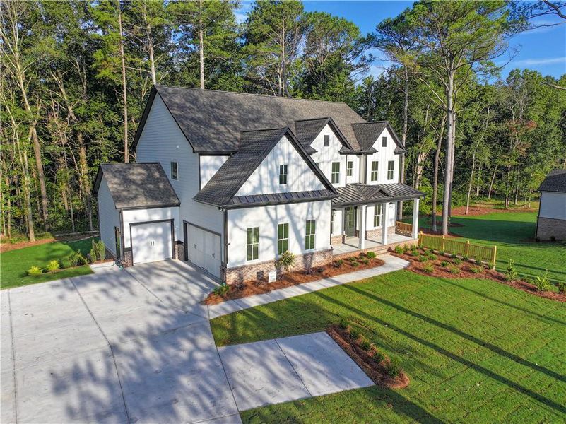 Front exterior of a new home in , Cumming, GA, highlighting curb appeal (Image 28). Front exterior of a new home in , Cumming, GA, highlighting curb appeal (Image 28).