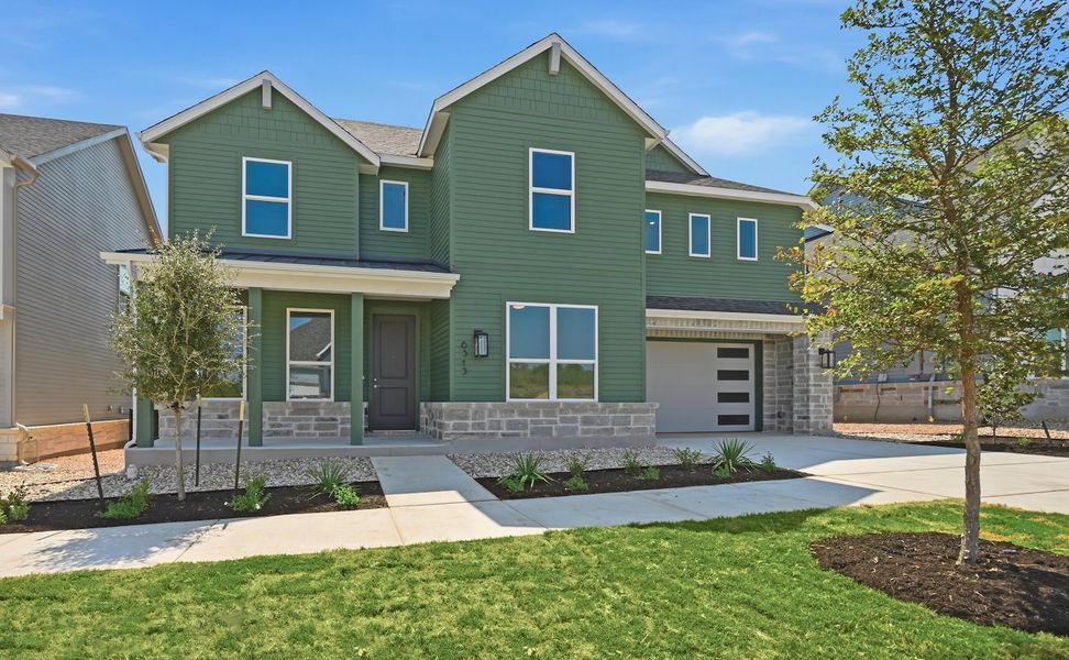 Front exterior of a new home in Goodnight Ranch, Austin, TX, highlighting curb appeal (Image 1). Front exterior of a new home in Goodnight Ranch, Austin, TX, highlighting curb appeal (Image 1).