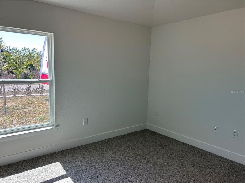 Spacious, unfurnished interior of a new home in Watercress Cove, North Port (Image 18).