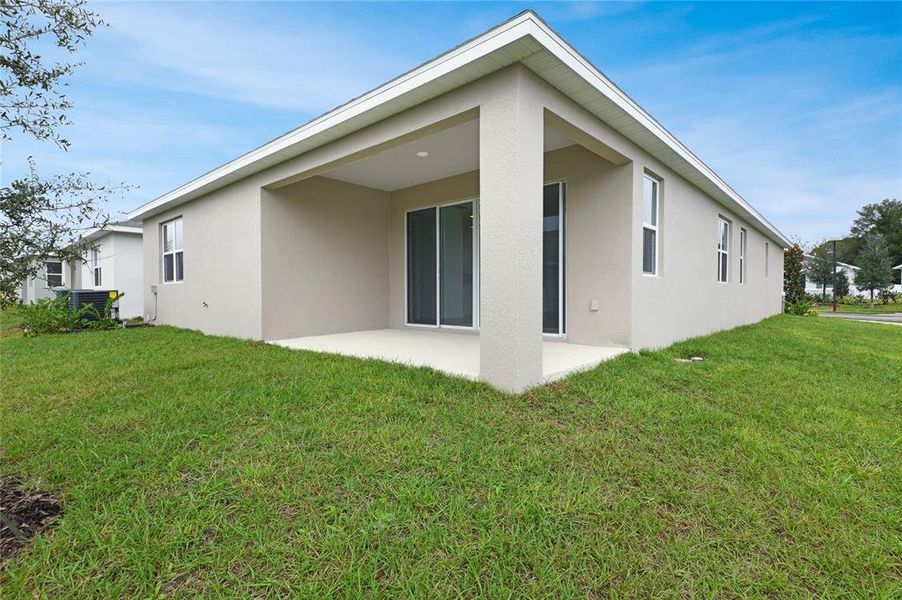 Exterior details and patio area of a home in Seasons at Grandview Gardens, Deland (Image 4).