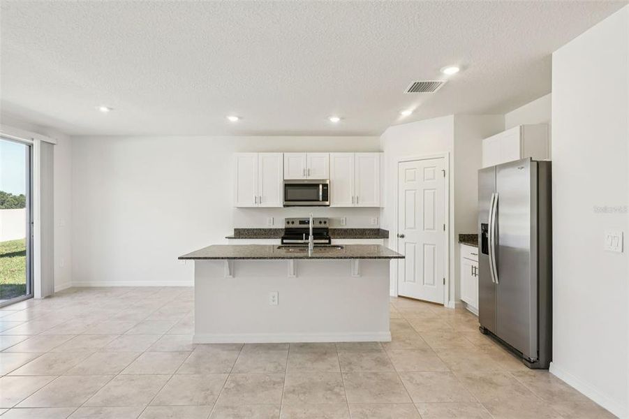 Furnished interior view inside a new home in Bradbury Creek - Signature Series, Haines City (Image 10).