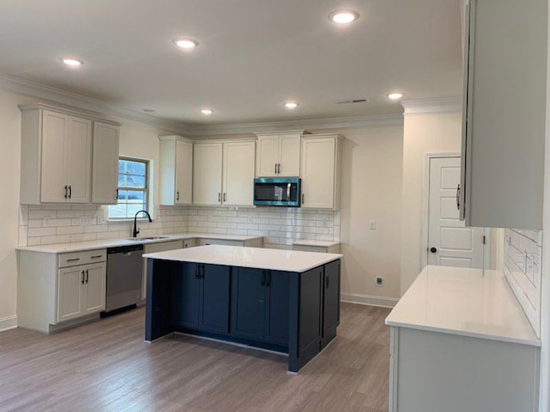Furnished interior view inside a new home in Royal Pines, Trinity (Image 4).