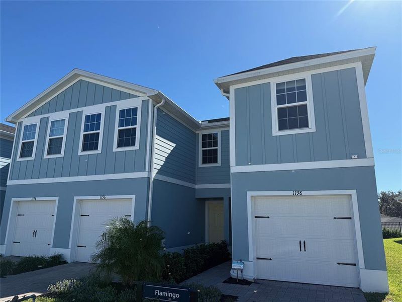 Front exterior of a new home in , Lady Lake, FL, highlighting curb appeal (Image 1).
