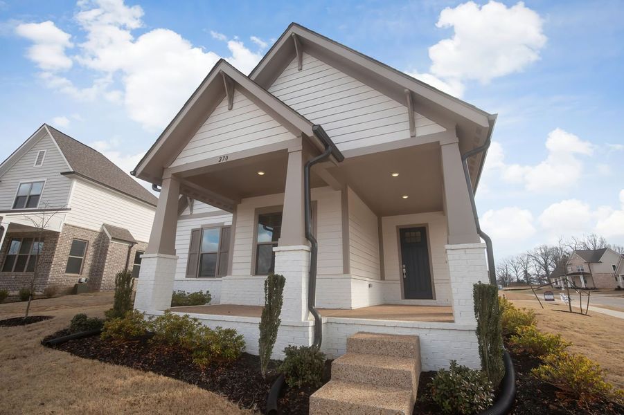 Front exterior of a new home in Twin Oaks, Oakland, TN, highlighting curb appeal (Image 25). Front exterior of a new home in Twin Oaks, Oakland, TN, highlighting curb appeal (Image 25).