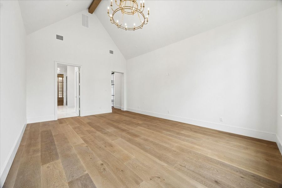 Primary Suite features 18' Cathedral ceilings and a beautiful Ridge Beam Primary Suite features 18' Cathedral ceilings and a beautiful Ridge Beam