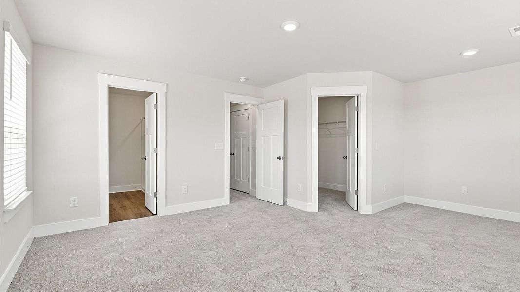 Eye-catching details and elegant finishes in the vibrant primary suite of this select home Eye-catching details and elegant finishes in the vibrant primary suite of this select home