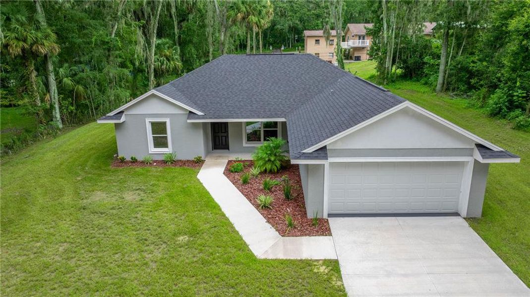 Front exterior of a new home in , Ocala, FL, highlighting curb appeal (Image 18).