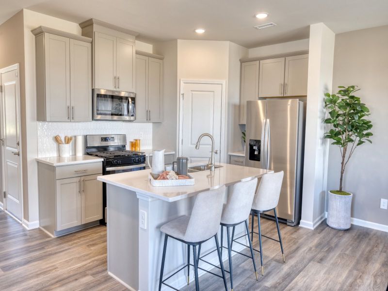 Kitchen in the Amber floorplan at a Meritage Homes community in Graham, NC.