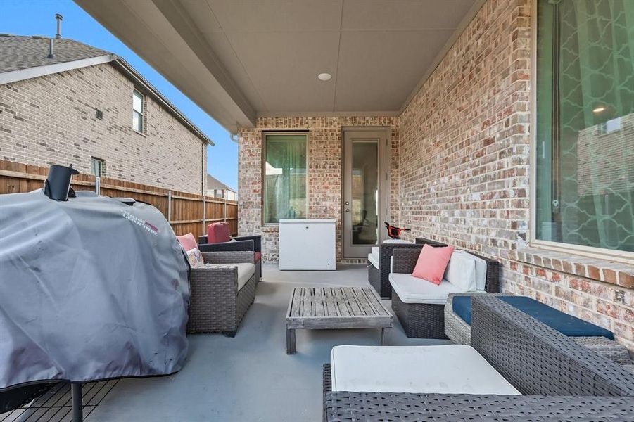 View of patio / terrace with area for grilling and an outdoor hangout area View of patio / terrace with area for grilling and an outdoor hangout area